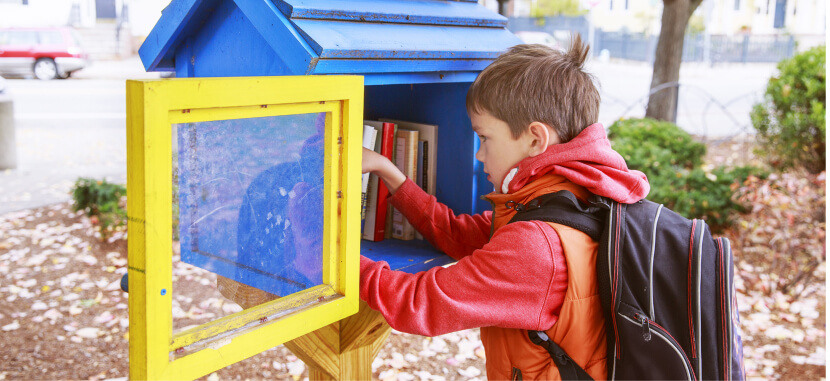 Boy-Taking-Book-From-Little-Free-Library