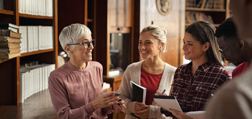 Group-of-people-talking-in-library