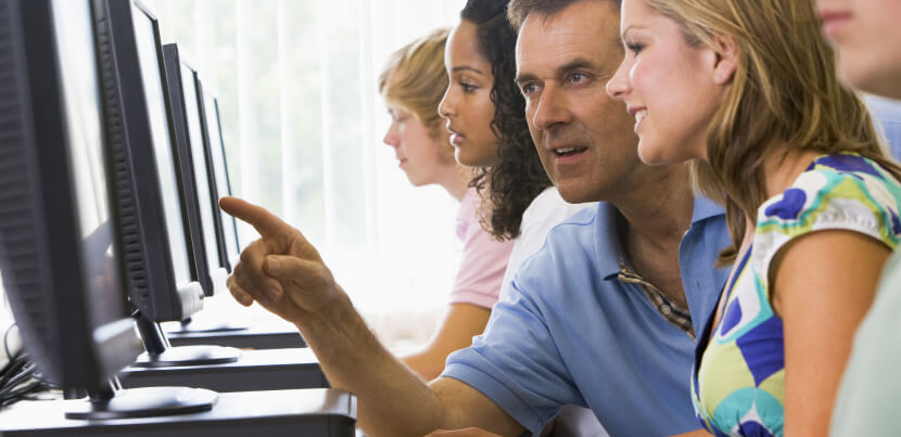 Teacher-pointing-at-computer-screen