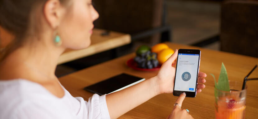 Woman-Using-Fingerprint-Lock-On-Phone