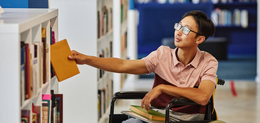 Young-Asian-in-wheelchair-in-accessible-library