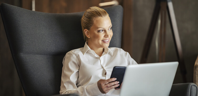 busineswoman-in-hotel-using-tech-devices