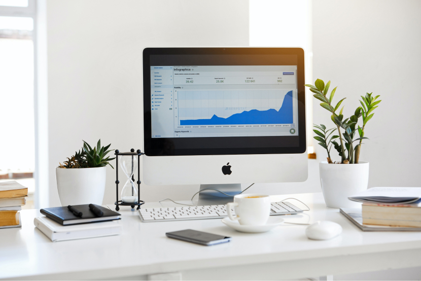 computer on a desk with a chart open