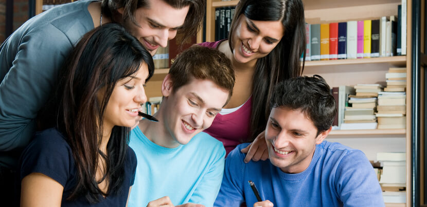 group-happy-students-in-library