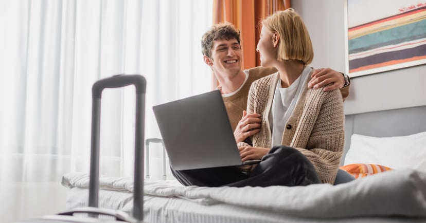 happy-young-couple-in-hotel