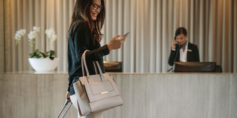 Hotel receptionist helping a guest