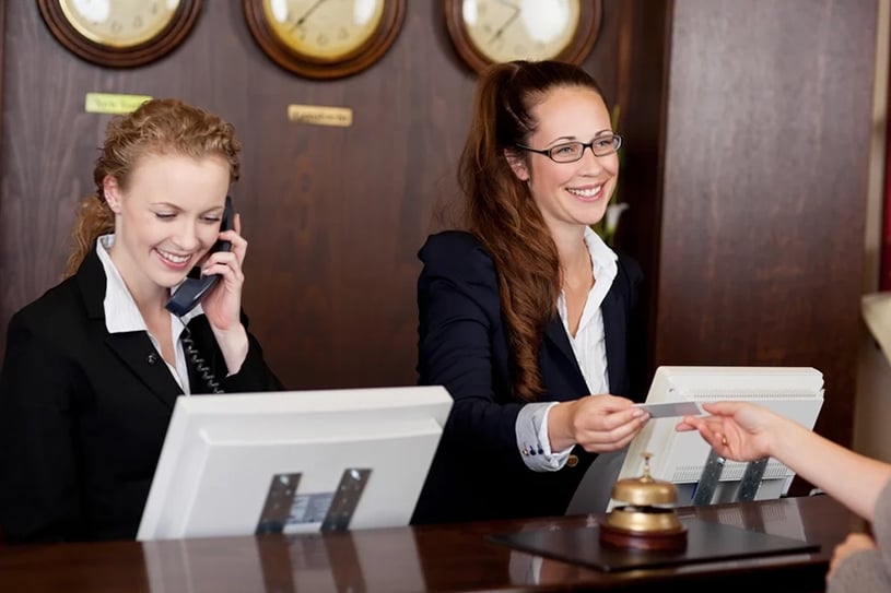 hotel concierge helping guests