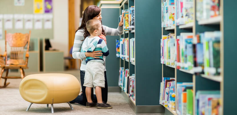 mother-and-child-at-library-shelf