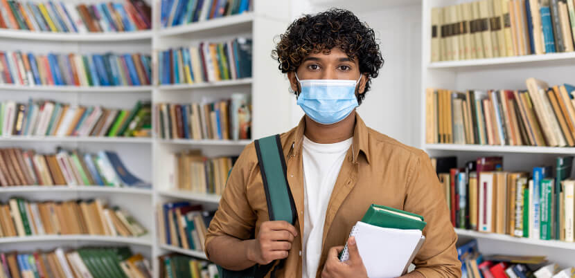 student-wearing-mask-in-library