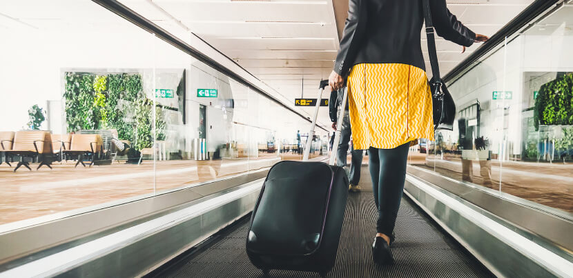 traveler-with-suitcase-at-airport