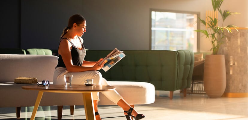 woman-reading-in-hotel-lounge