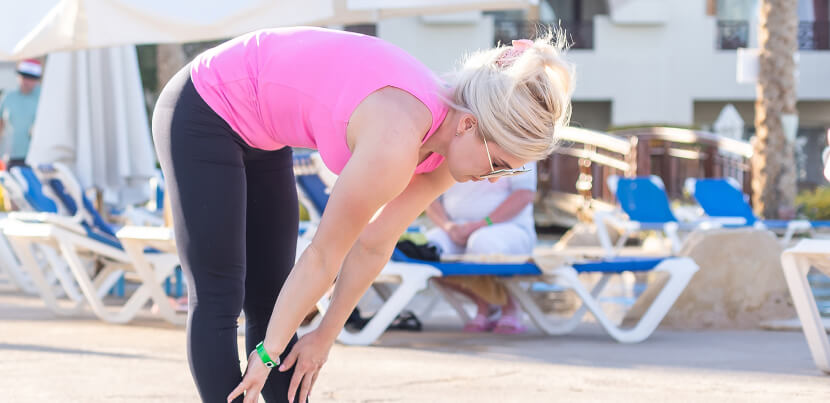 woman-stretching-before-exercise-at-hotel