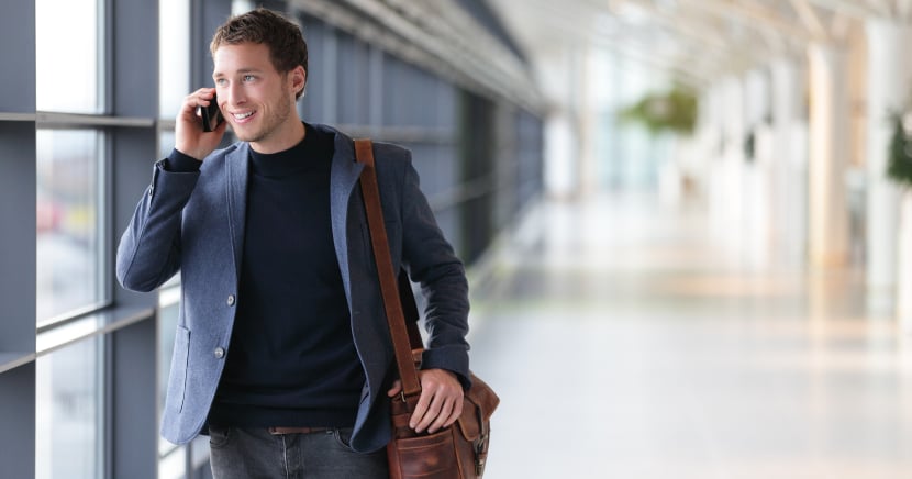 Casual-Business-Traveller-on-Call-at-Airport